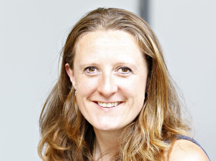 Women with light brown hair smiling at camera