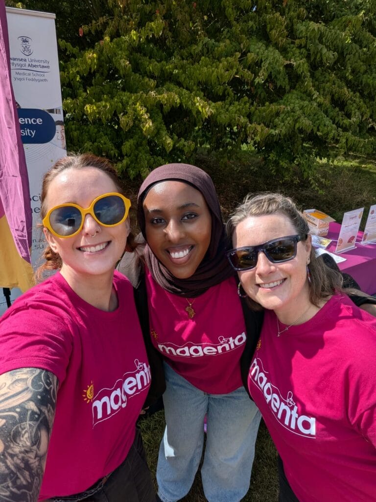 Three women smiling at the camera